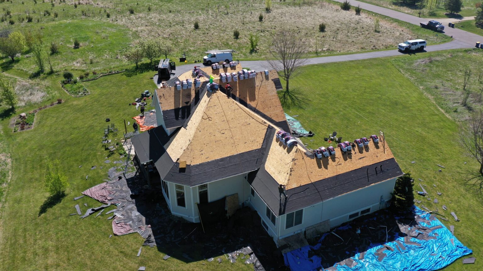 Roofing crew at work, aerial view, Millersburg MN